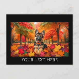 German Shepherd Puppy Playing in Autumn Leaves Postcard