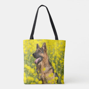 German Shepherd(s) in field of yellow flowers tote Bag