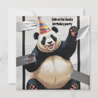 Giant panda sitting up wearing birthday hat