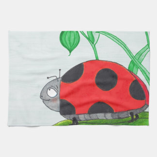 Giant red ladybug on a leaf tea towel