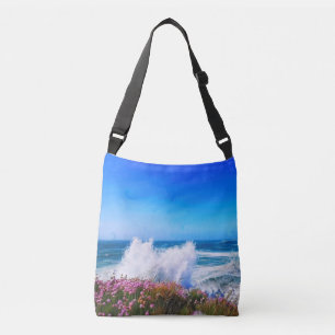 Giant wave over pink flower covered headland crossbody bag