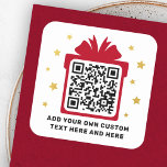 Gift box with faux golden stars QR code Christmas Square Sticker<br><div class="desc">Business QR code stickers featuring your QR code on a red (or custom colour) gift box silhouette surrounded by golden gradient (printed colour image,  not real foil) stars. Text,  font and colours are customisable. Perfect for directing your customer to a gift or freebie.</div>