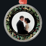 Gilded Greenery Black | Married and Merry Photo Metal Tree Decoration<br><div class="desc">This gorgeous newlyweds holiday keepsake ornament feature a lush, festive wreath of gold leaves, Christmas greenery, and red holly berries on a modern black background. Your personal wedding photo goes in the center along with the words "Married and Merry", and there is even a spot for your name and the...</div>