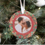 Gilded Greenery Red | Married and Merry Two Photo Ornament<br><div class="desc">This gorgeous newlyweds holiday keepsake ornament feature a lush, festive wreath of gold leaves, Christmas greenery, and red holly berries on a modern red background. Your personal wedding photo goes in the centre along with the words "Married and Merry", and there is even a spot for your name. A second...</div>
