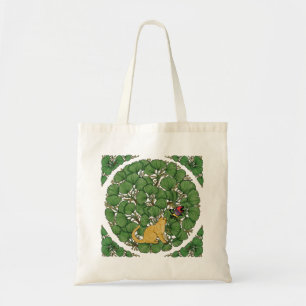 Ginger cat looks at a butterfly tote bag