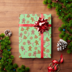 gingerbread cookies and candy canes on green wrapping paper