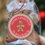 Gingerbread Man with Santa Hat Merry Christmas Classic Round Sticker<br><div class="desc">Add a touch of warmth and joy to your Christmas gifts with our customisable sticker! This charming sticker features a delightful gingerbread man, adorned with a festive Santa hat, set against a vibrant red background. Radiating white stripes create a starburst effect, framing the cheerful message "MERRY CHRISTMAS". Personalise it with...</div>