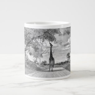 Giraffe on the road large coffee mug