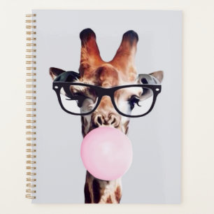 Giraffe wearing glasses blowing pink bubble gum planner