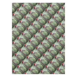 Giraffe with a Santa Claus Hat on Tablecloth