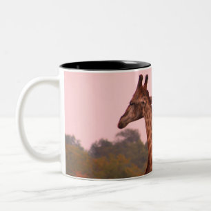 Giraffes with a pink sky Two-Tone coffee mug