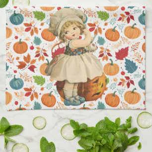 Girl Carving Apple and Colourful Pumpkins Hallowee Tea Towel