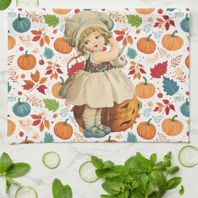 Girl Carving Apple and Colourful Pumpkins Hallowee Tea Towel (Folded)