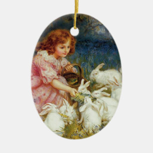 Girl feeding rabbites ceramic tree decoration