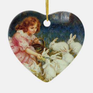 Girl feeding rabbites ceramic tree decoration