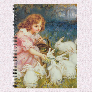 Girl feeding rabbits notebook