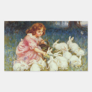 Girl feeding rabbits rectangular sticker