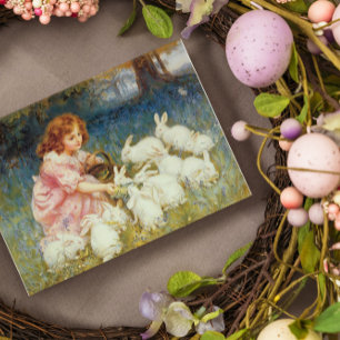 Girl feeding rabbits rectangular sticker