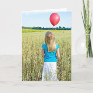 girl in wheat field with red balloon birthday card