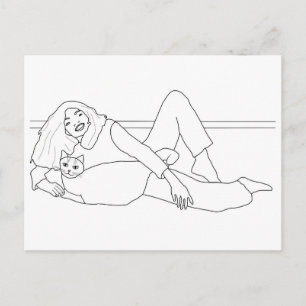 Girl laying by cat, colouring postcards