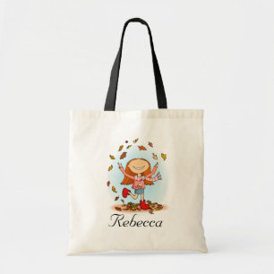 Girl playing in leaves fall library name bag