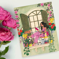 Girl reading on summer balcony with cats
