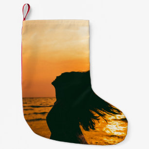 Girl silhouette, sea sunset, freedom. small christmas stocking