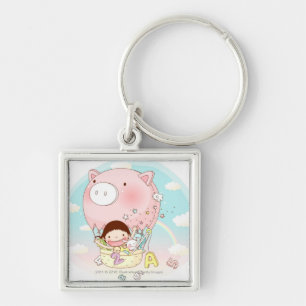 Girl sitting in hot air balloon, smiling key ring