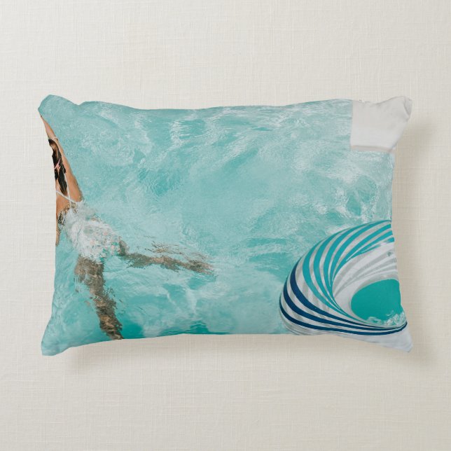 Girl wearing swimsuit and swims in swimming pool decorative cushion (Front)