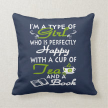 Girl with a cup of tea and a book