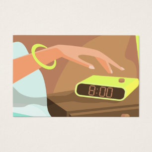 Girls hand pushing on alarm clock snooze button