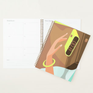 Girls hand pushing on alarm clock snooze button planner