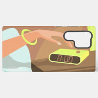 Girls hand pushing on alarm clock snooze button