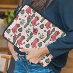 Girly Country Cowgirl Christmas Pink and Green Laptop Sleeve<br><div class="desc">This festive girly country cowgirl Christmas laptop sleeve features a pattern of hand-drawn western illustrations of cowgirl boots,  cowgirl hats,  cactus,  mittens & holly berries,  all against a background full of tiny stars. 
Elegant soft pink background.</div>