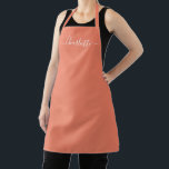 Girly salmon custom modern script name monogram  apron<br><div class="desc">Personalised salmon custom modern script name text monogram solid plain colour girly stylish elegant chic salmon and white text kitchen Apron. Customise,  personalise it with name,  quote,  phrase,  or text.
Great for cooks,  chefs,  pottery,  ceramics,  crafts,  work,  kitchen,  baking,  bbq,  grill,  etc</div>