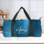 Glam Teal Blue Brushed Metal White Monogram  Duffle Bag<br><div class="desc">This personalised duffel bag features a monogram and first name in modern turquoise and white script on a glam teal blue faux brushed metal background.</div>