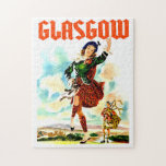 Glasgow, Woman in Kilt, Jigsaw Puzzle<br><div class="desc">Glasgow Puzzles. Woman dancing in national Scotland dress,  kilt,  while a man playing in pipe on a clear day. Scotland mountains and a castle on the background.</div>