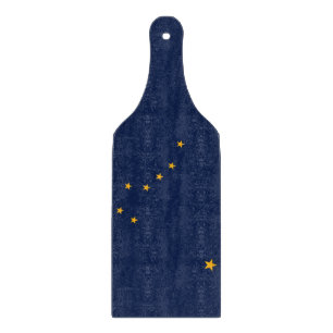 Glass cutting board paddle with flag of Alaska