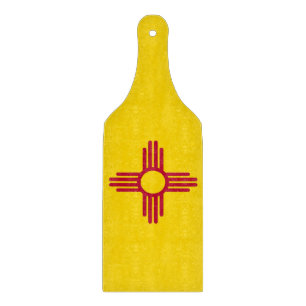 Glass cutting board paddle with New Mexico flag