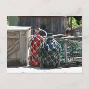 Glass fishing floats red blue infront postcard