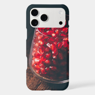 Glass full of red pomegranate seeds