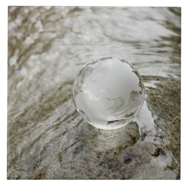 Glass globe on the water stream tile (Front)