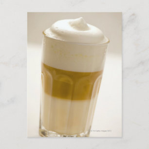 Glass of latte macchiato, close up postcard