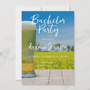 Glass of light beer on field invitation