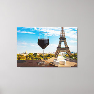 Glass of wine with brie cheese on Eiffel tower Canvas Print