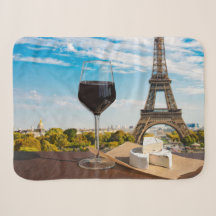 Glass of wine with brie cheese on Eiffel tower