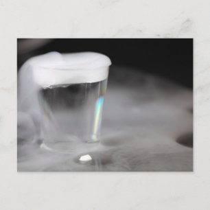 Glass with water and dry ice postcard