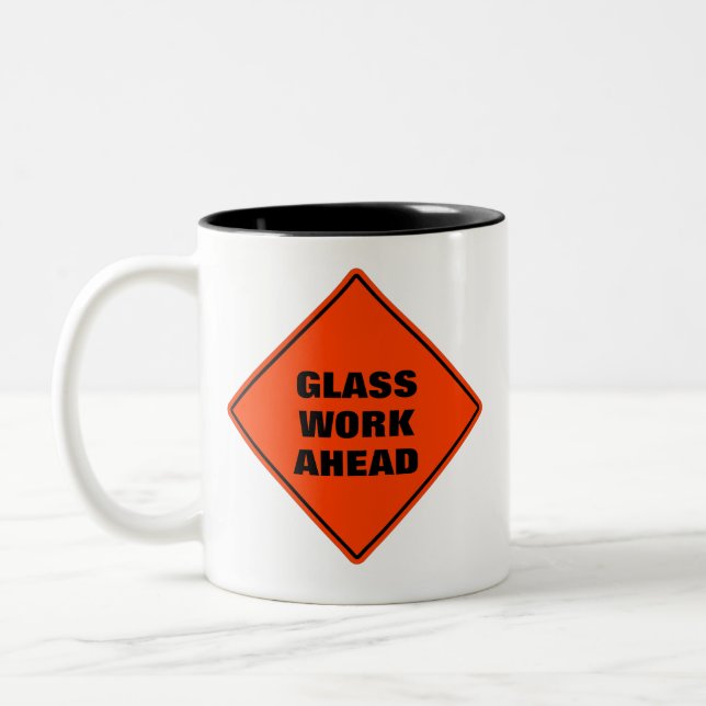 Glass work ahead classic orange caution road sign Two-Tone coffee mug (Left)