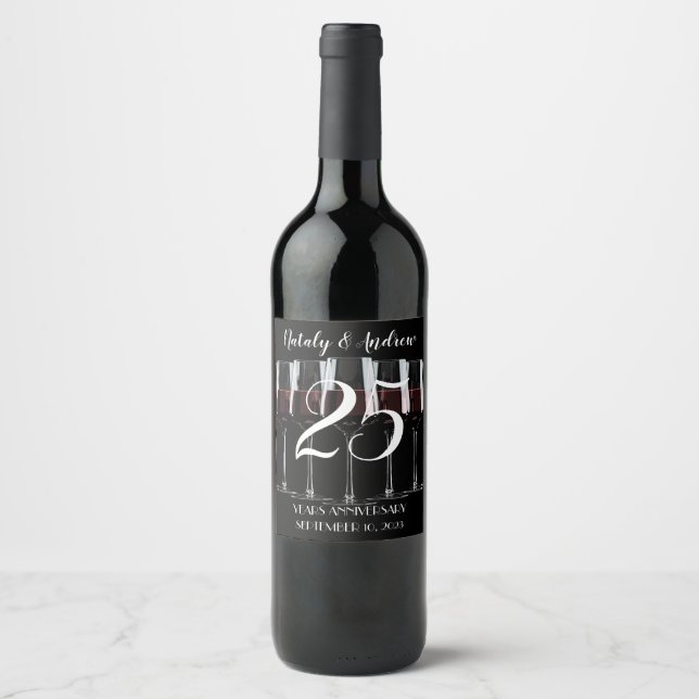 Glasses of red wine on black label (Front)