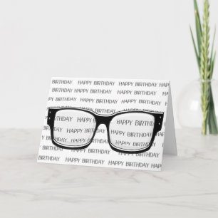 glasses on blurred birthday text card